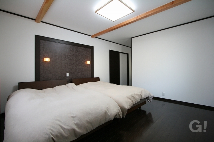 注文住宅のホテルライクな高級感漂う主寝室の写真
