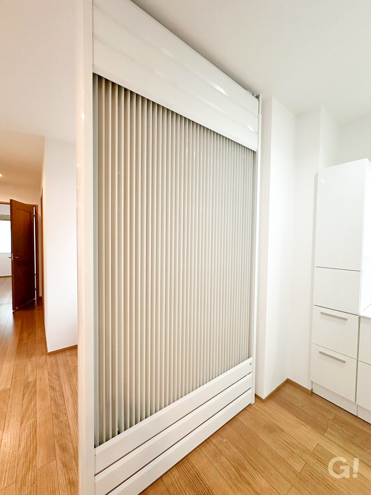 タイル貼りの二世帯住宅の輻射式冷暖房の写真